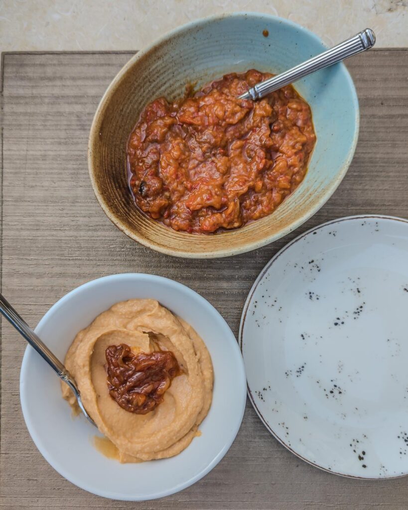 Dinner in Bucharest. Zacuscă (aubergine spread) and fasole bătută (white beans spread), mushrooms ciorbă from Bukovina, and sărmăluțe (cabbage rolls) filled with wild boar
