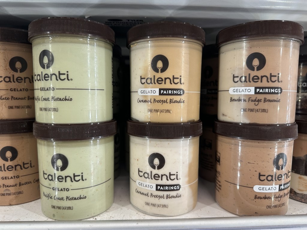 Talenti gelato pints in a grocery store freezer.