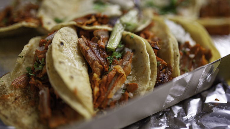 Al pastor tacos on corn tortillas