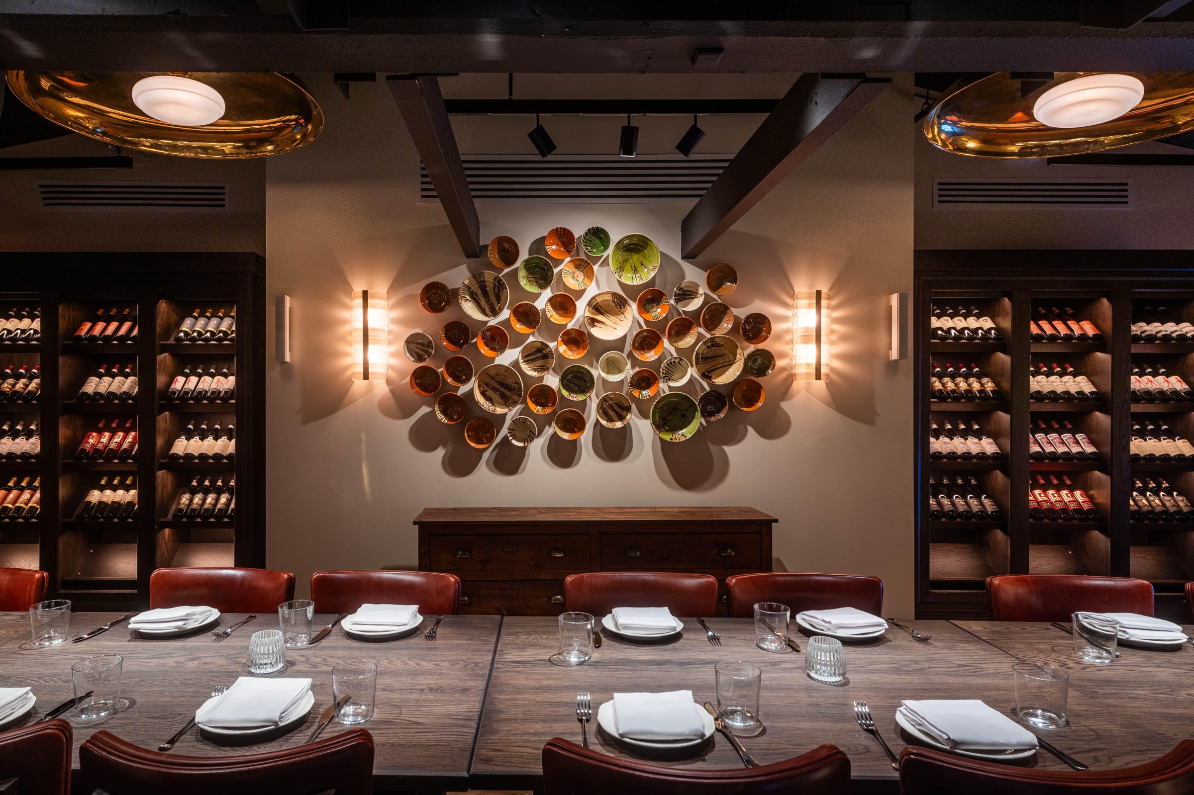 Homemade pottery and wine bottles line the upstairs private dining room that seats up to 21 guests.