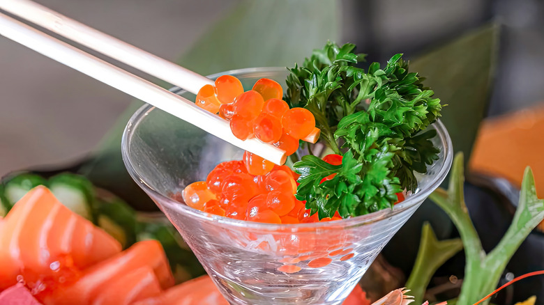 Red caviar in a cocktail glass