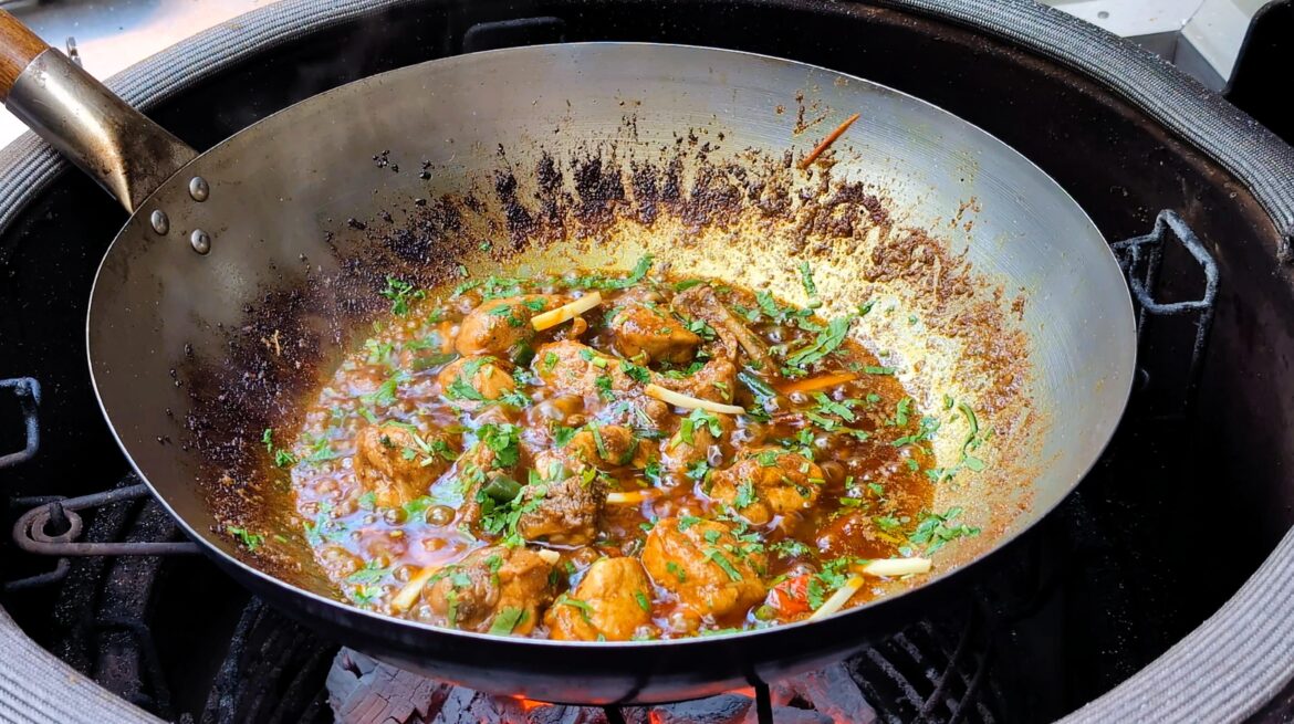 Masala chicken karahi cooked over charcoal on the Kamado Joe.