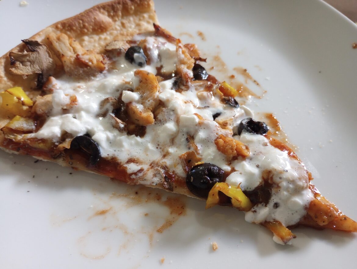 Ordered a pizza without cheese for low-fat reasons. Added fat-free cottage cheese at home and microwaved it.