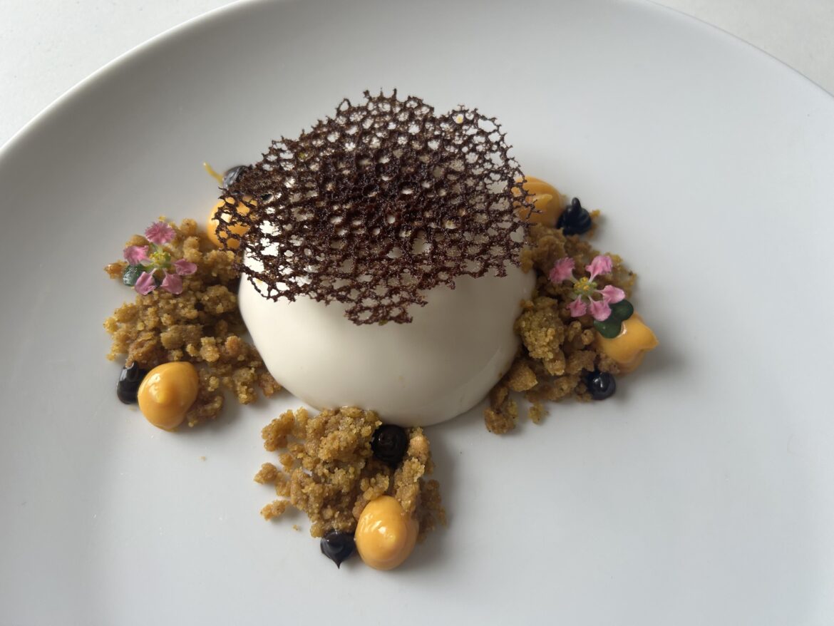 Coconut and pandan panna cotta, pistachio and white choc crumble, mango cremeux, chocolate ganache