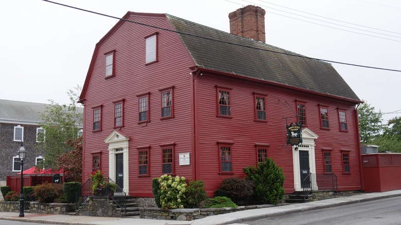 The exterior of White Horse Tavern, a large red building