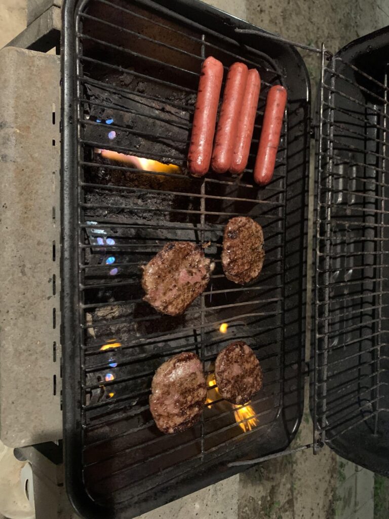 Fired up the Walmart special for some quick burgers and sausages.