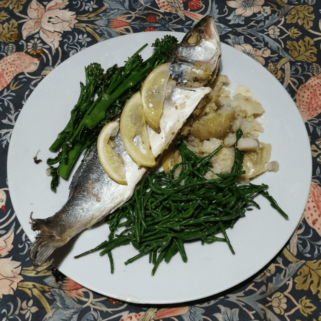 Sea bass stuffed with herb butter and breadcrumbs, with samphire, sprouting broccoli, sprouting "rockoli" and buttered jersey royals