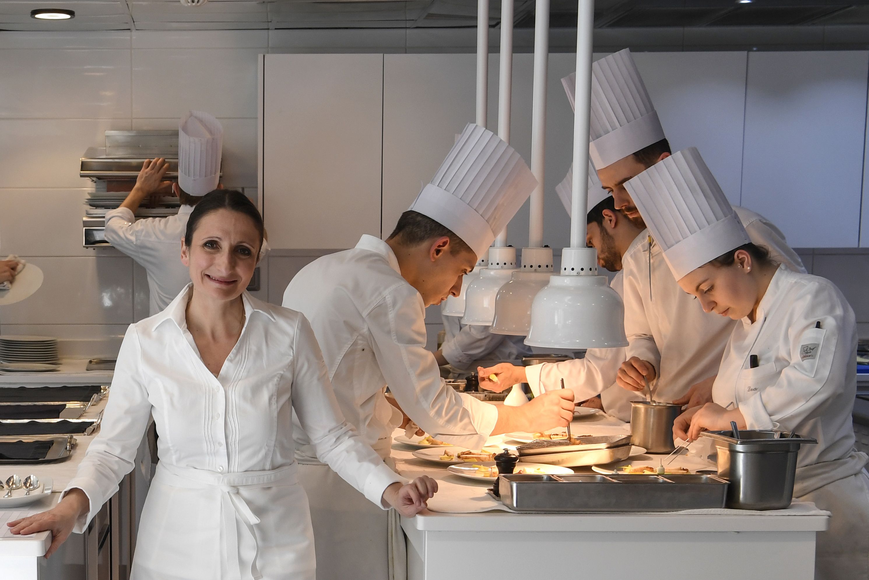 Anne-Sophie Pic, a three-Michelin-starred chef, in her restaurant kitchen.