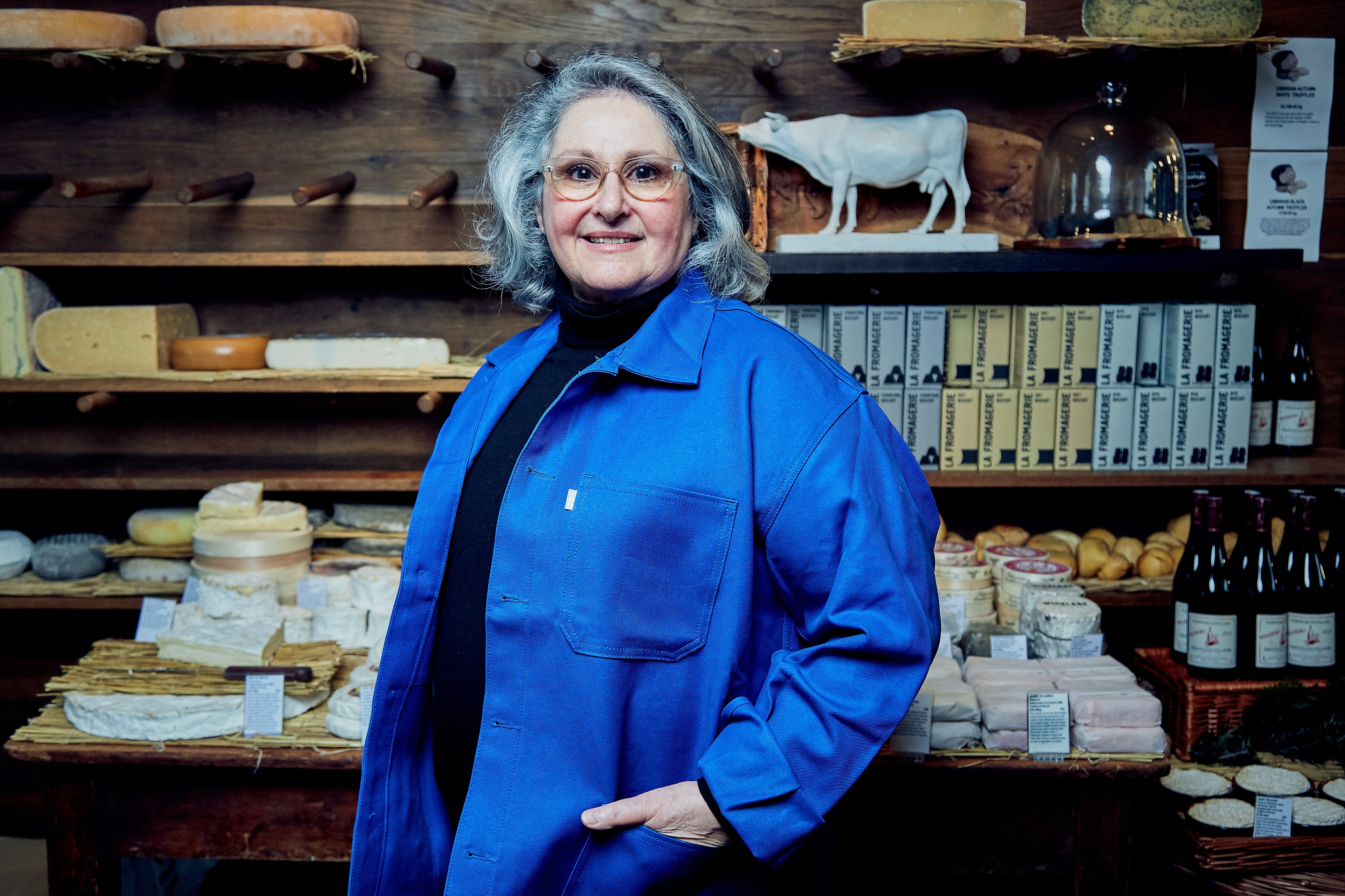 Portrait of Patricia Michelson at La Fromagerie cheese shop.