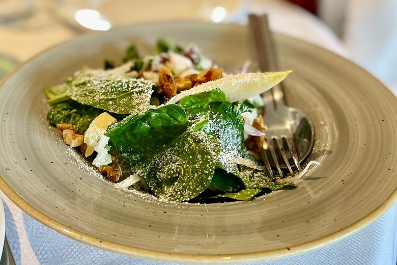 The Romini lettuce salad features hazelnuts, Bleu d’Auvergne cheese and lemon Caeser dressing.