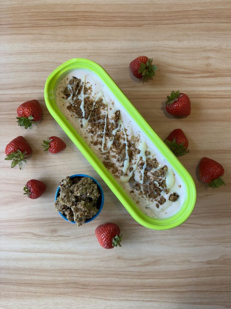 Strawberry ice cream with oat crisp and condensed milk swirl