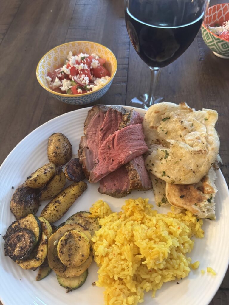 Smoked lamb, watermelon and cucumber salad, roasted potatoes, squash and zucchini