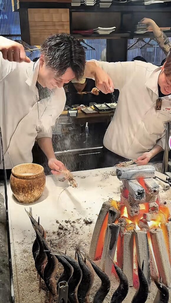 Been a good 7 years since I visit Japan. I recently saw this recently on social media, basically salting seafood and placing them next to the fire to cook on a skewer, where can I go to eat this in Japan?