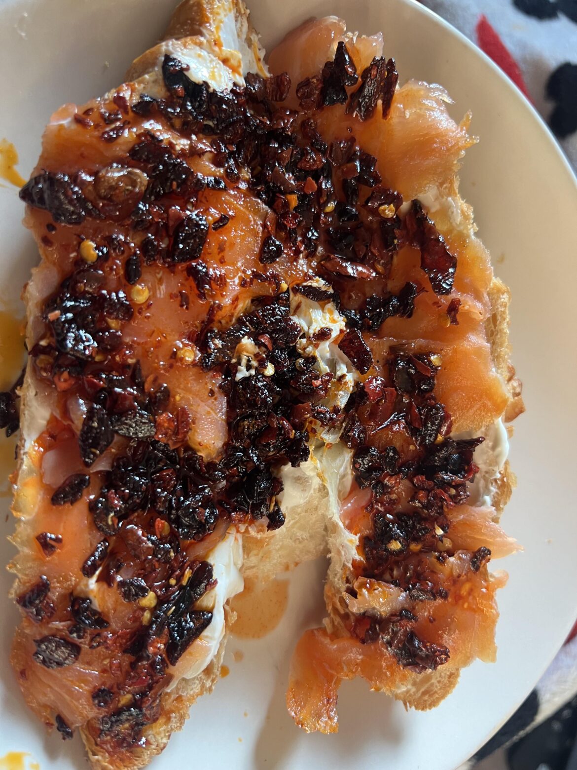 Croissant with cream cheese, smoked salmon, a little tobasco and an obnoxious amount of chilli crisp