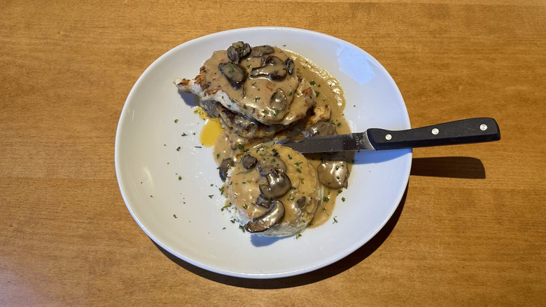 Olive Garden stuffed chicken marsala on a white plate