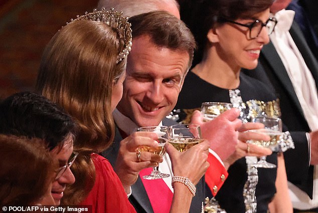 Emmanuel Macron winked as he clinked glasses with the Princess of Wales at last night's state banquet
