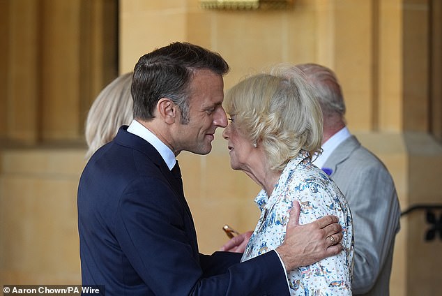 Emmanuel Macron is seen bidding farewell to Queen Camilla following the morning visit to the grounds of Windsor Castle