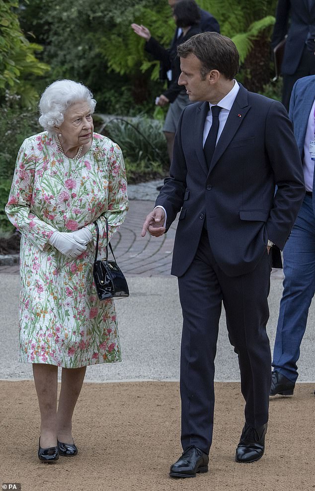 Mr and Mrs Macron also laid flowers at the tomb of the late Queen Elizabeth II during the Windsor Castle gardens tour on Wednesday after paying tribute to her at last night's State Banquet (pictured with the late Queen in 2021 during the G7 summit in Cornwall)