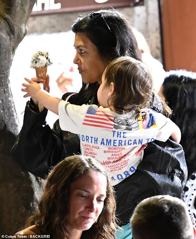 At one point the toddler was pictured reaching out for Kourtney's ice cream cone
