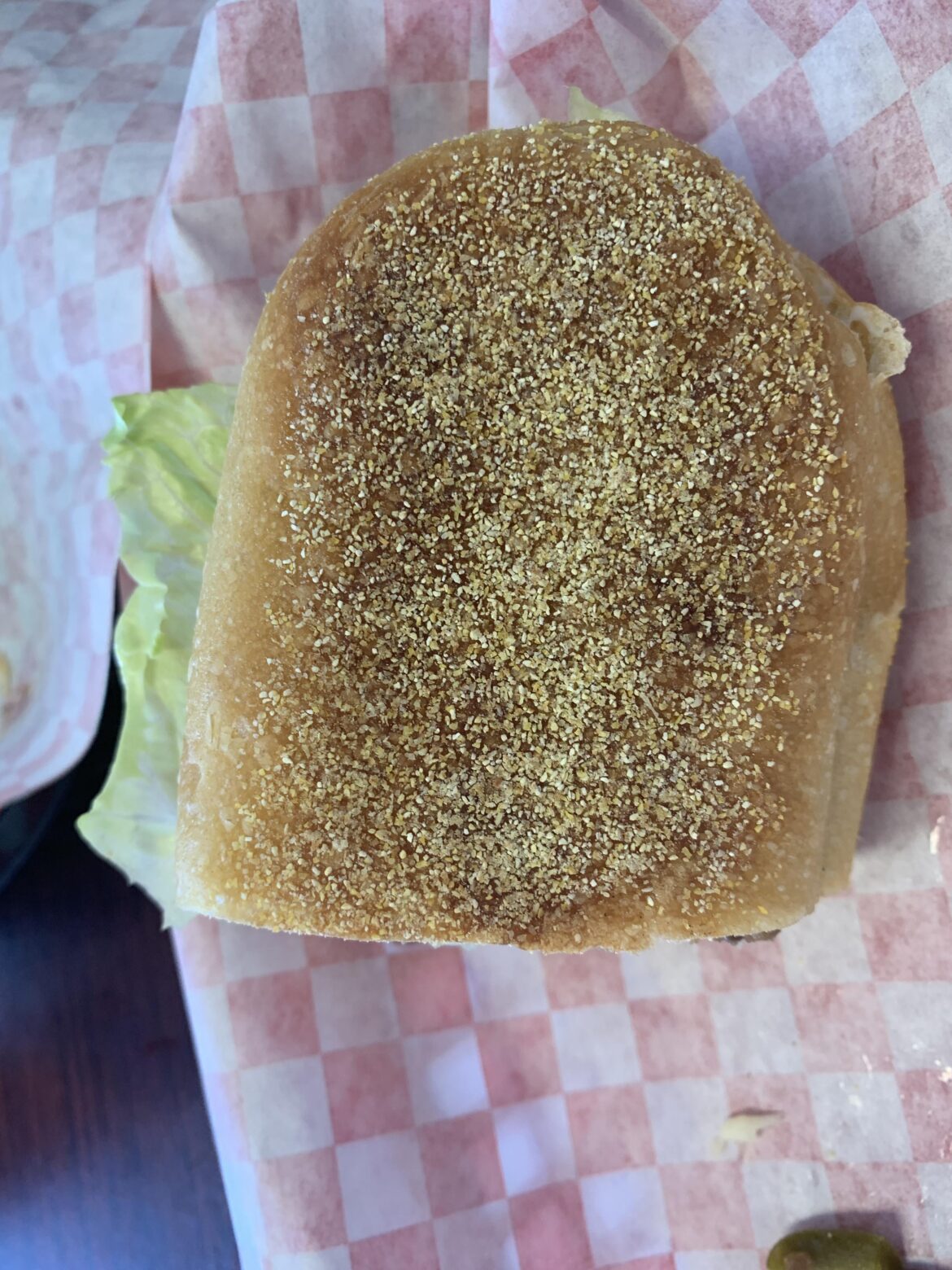 What is this seed-like mixture on the bottom of this restaurant bread?