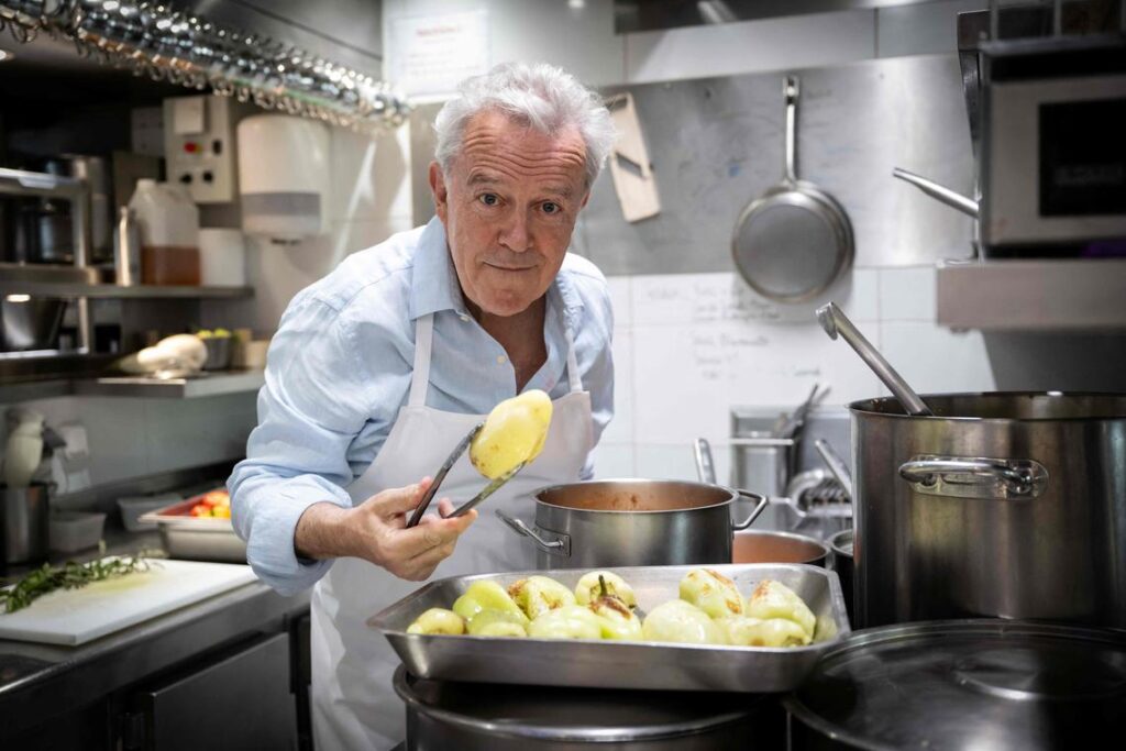 French chef Alain Passard poses in his restaurant 'L'Arpege' in Paris during a photo session on July 22, 2025. Incomparable "gustatory emotions": for the first time in a three-star restaurant in France, Alain Passard is now serving exclusively plant-based cuisine, a sign of a still discreet but real turning point in haute gastronomy. (Photo by BERTRAND GUAY / AFP)