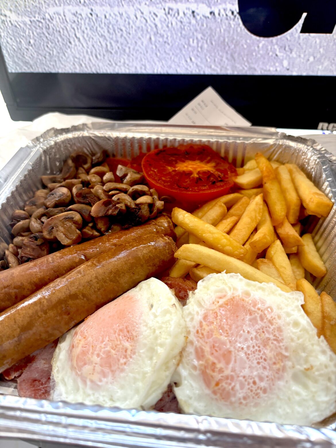 Never even thought of using Uber eats for a fry up. £14 for this + coffee.  (Bacon at the bottom and beans on the side)