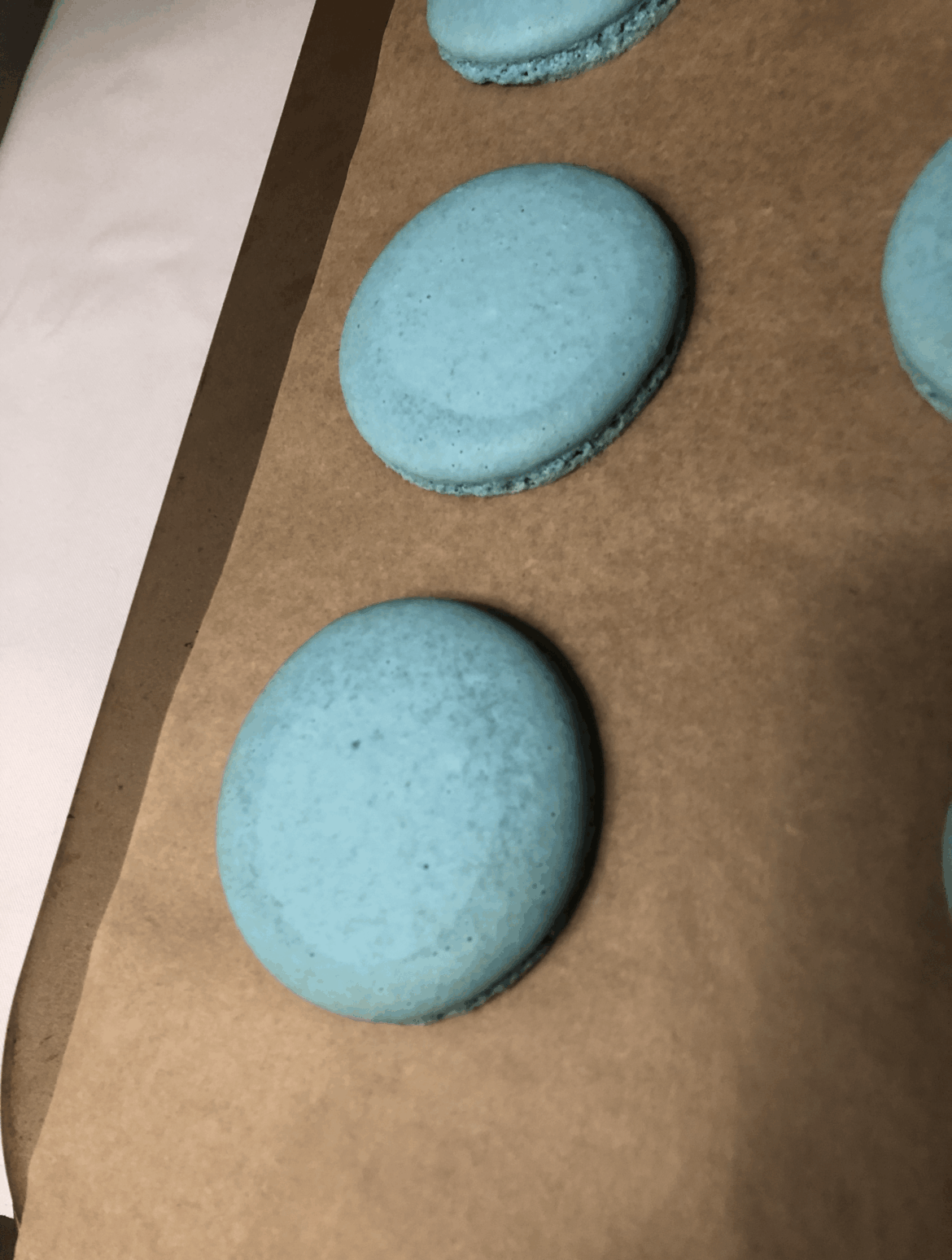 Started getting this towards the end of my batch, the rest all cooked fine. Any reason this happened? Looks like it cooked in the middle but not on the edges, and the speckled parts are deflating, but the bottoms are toasted light brown and they didn't stick at all