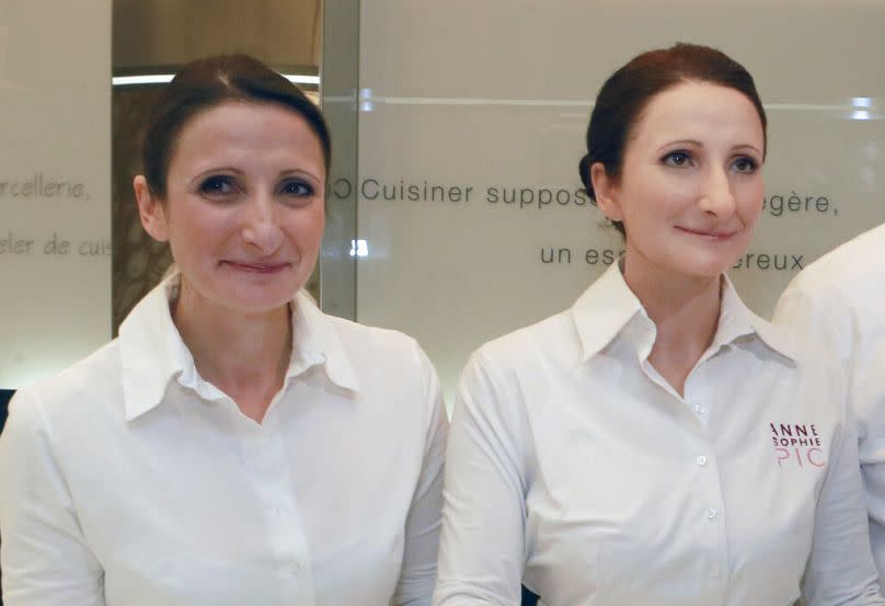 Anne-Sophie Pic, left, stands with a life-size wax figure of herself, during the presentation of the culinary wax figures in Paris, France, 2015.