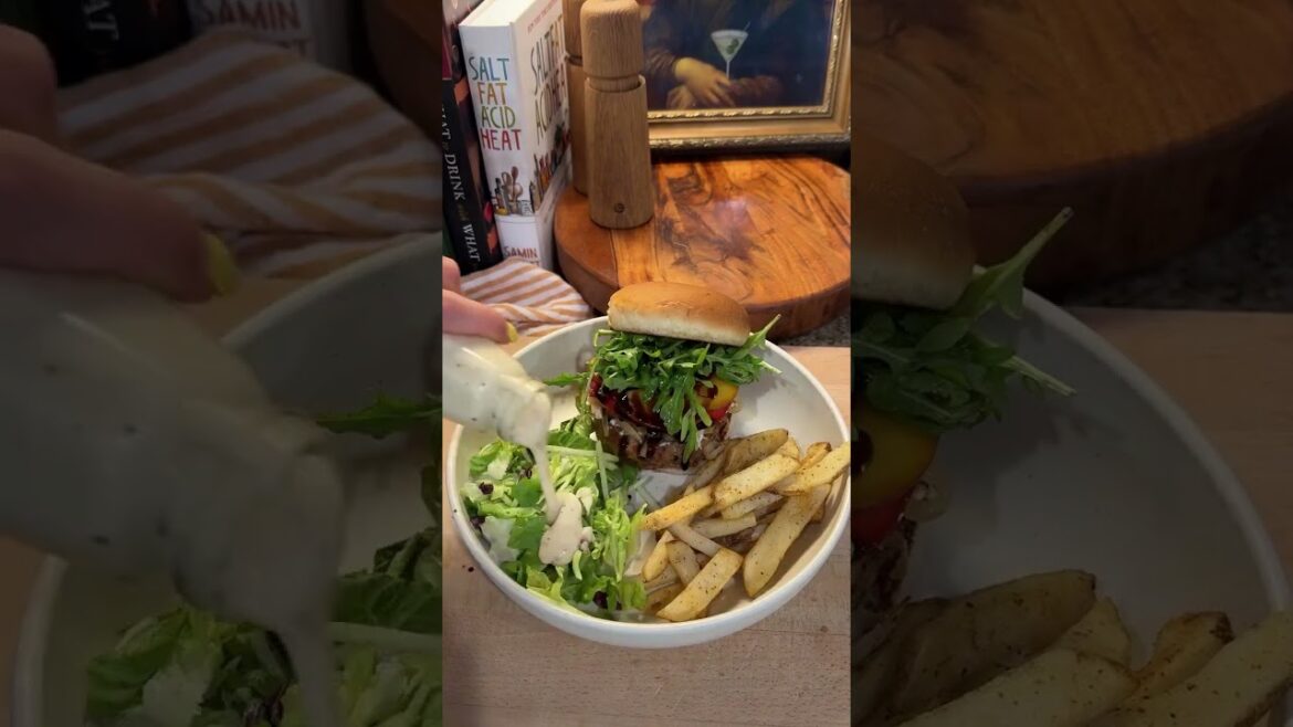 Turkey burger with peaches, caramelized onions, arugula, tomato, goat cheese, balsamic glaze .