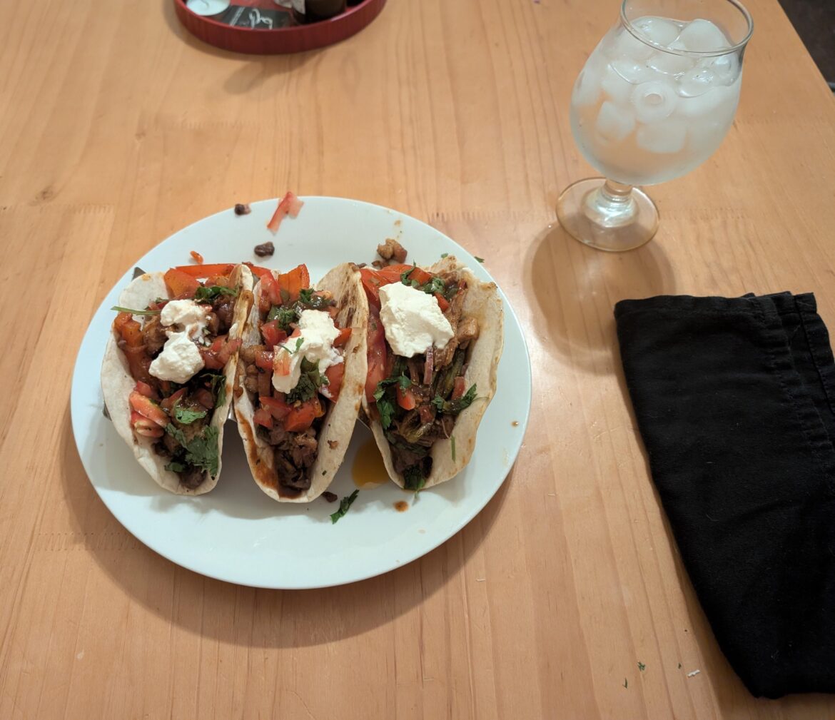 I made chicken tacos with, fried peppers, homemade refried beans, fried onions, tomatoes, cilantro and hot sauce, and sour cream.