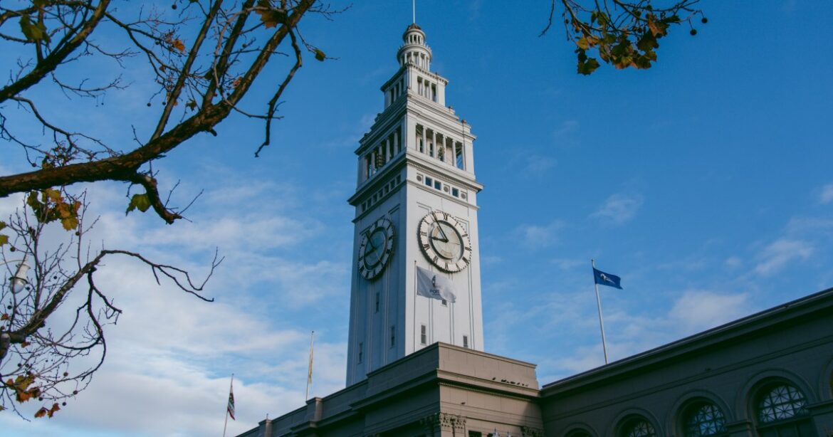 A16 team to open Lucania at Ferry Building next year A table is filled with various Italian dishes, including pasta, pizza, seafood, skewers, and desserts, all artfully plated on white dishes.
