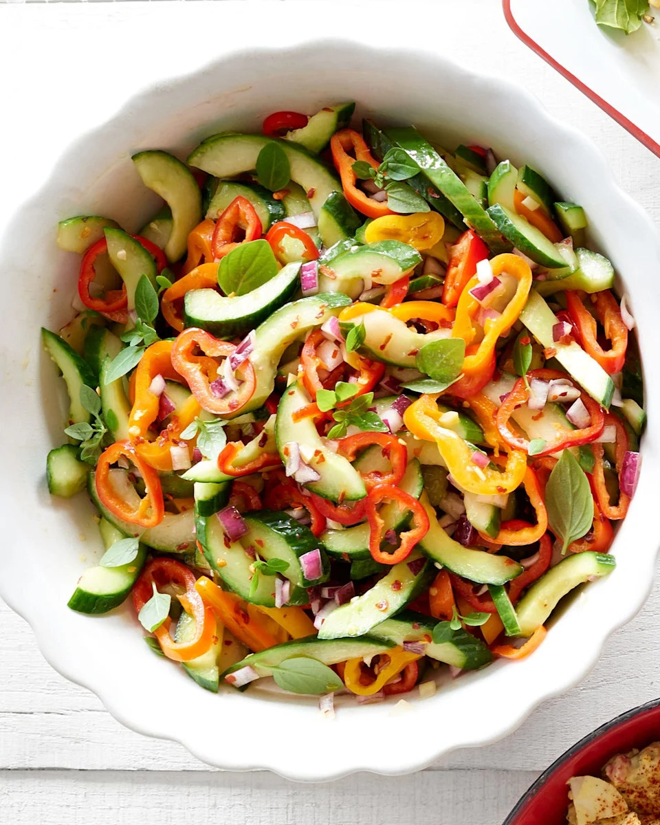 ginger, cucumbers and pepper salad in a white bowl
