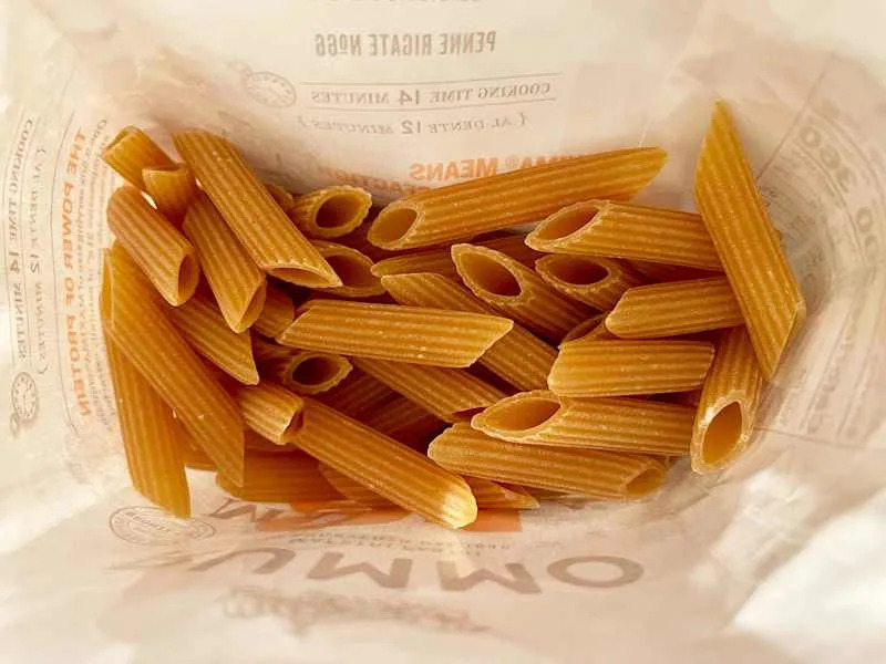 Dried Rummo Maxima penne rigate pasta, view into bag