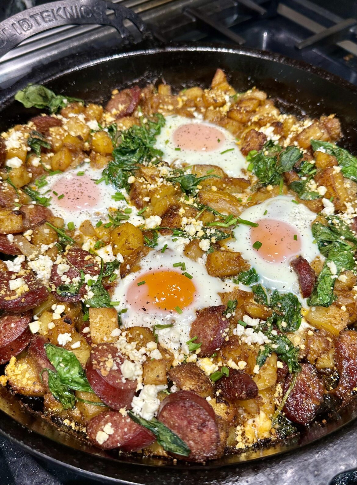 [homemade] Roasted potatoes, sausage, spinach and eggs