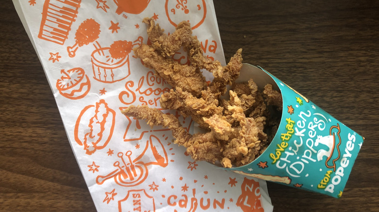 Order of Popeyes Chicken Dippers spilling out of the container