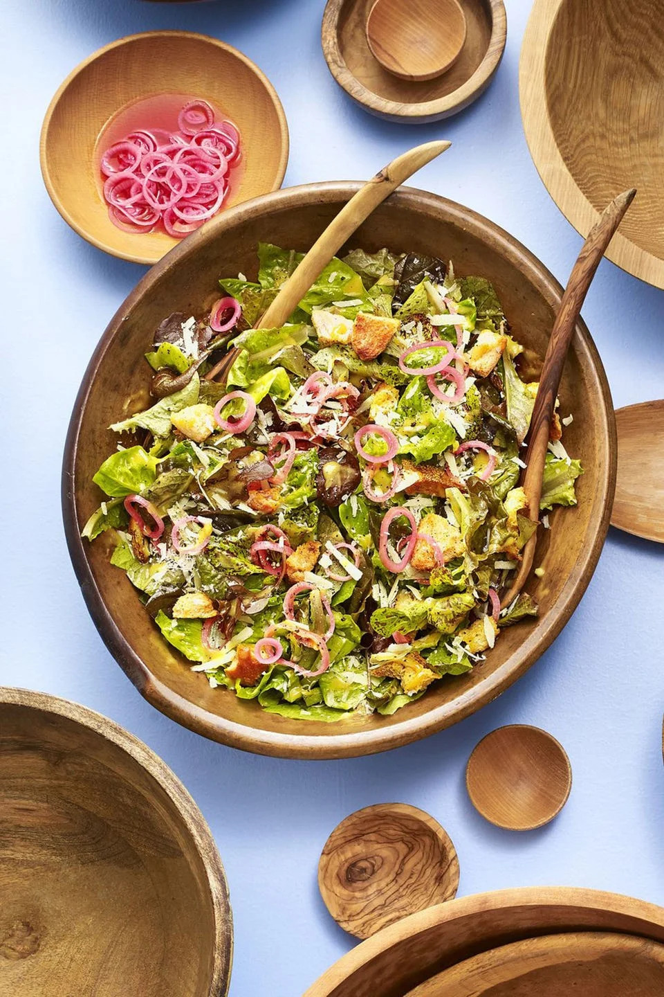 spring greens caesar salad with pickled shallot