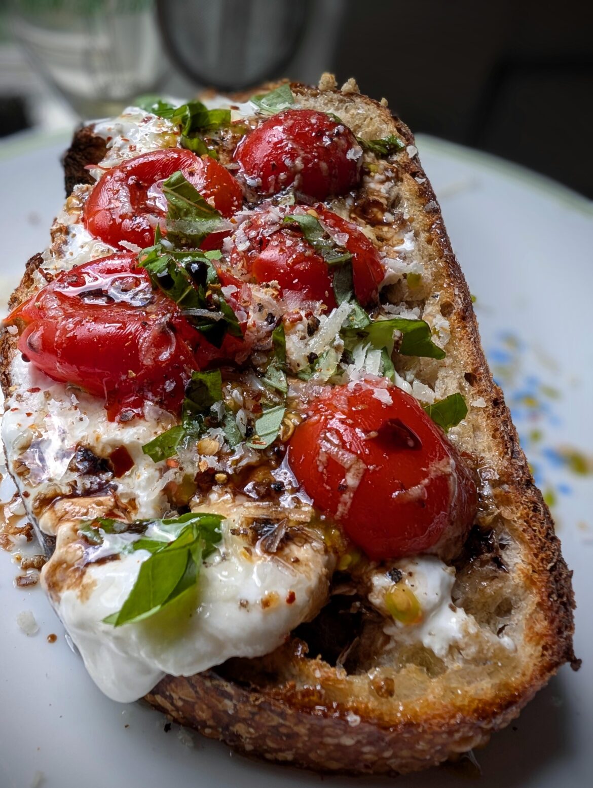 Sourdough with burrata, tomato, basil, Parm Reggiano, oil and balsamic. [OC]
