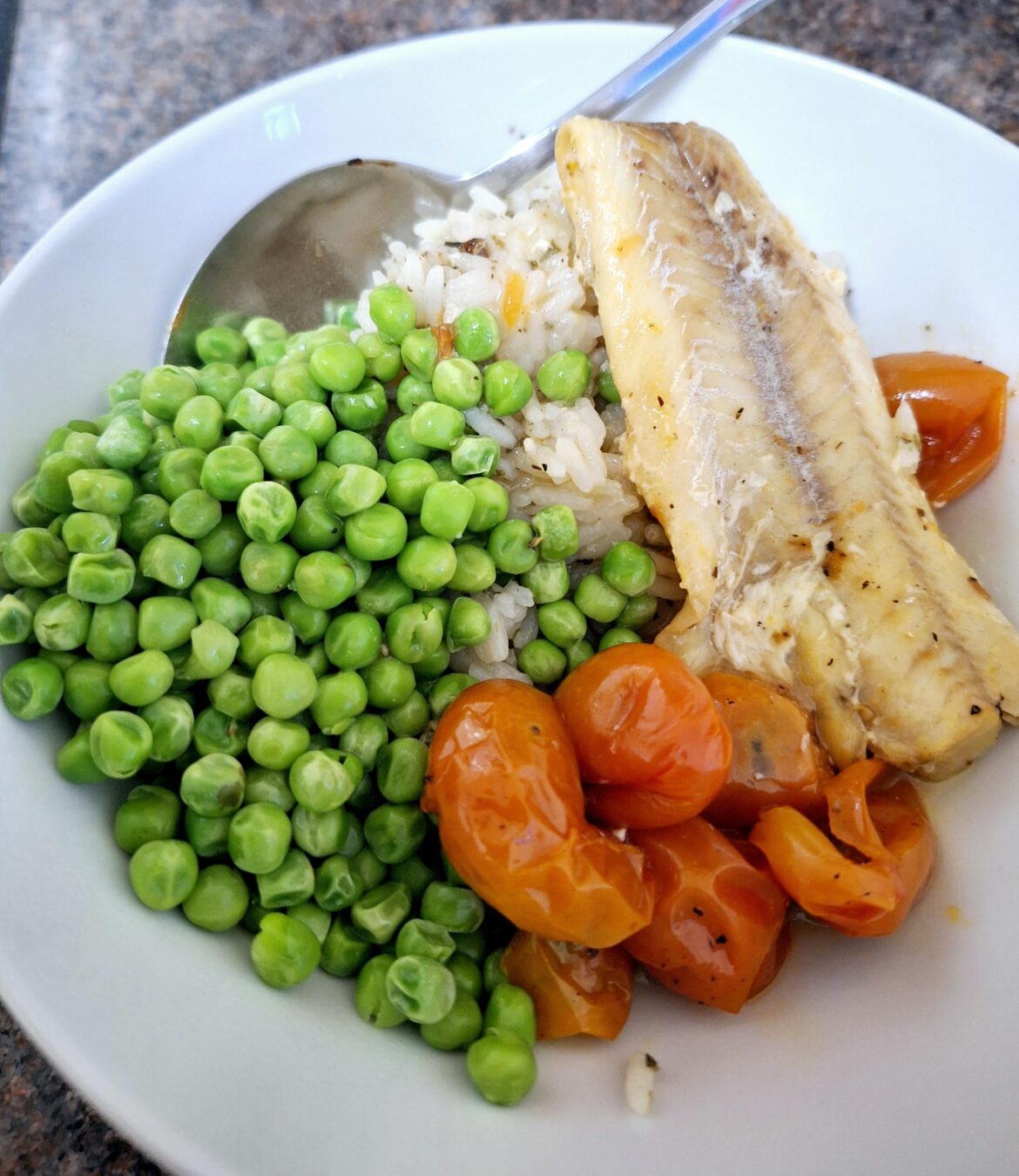Steamed Lemon fish, cherry tomatoes served with oregano chive rice and petit pois.