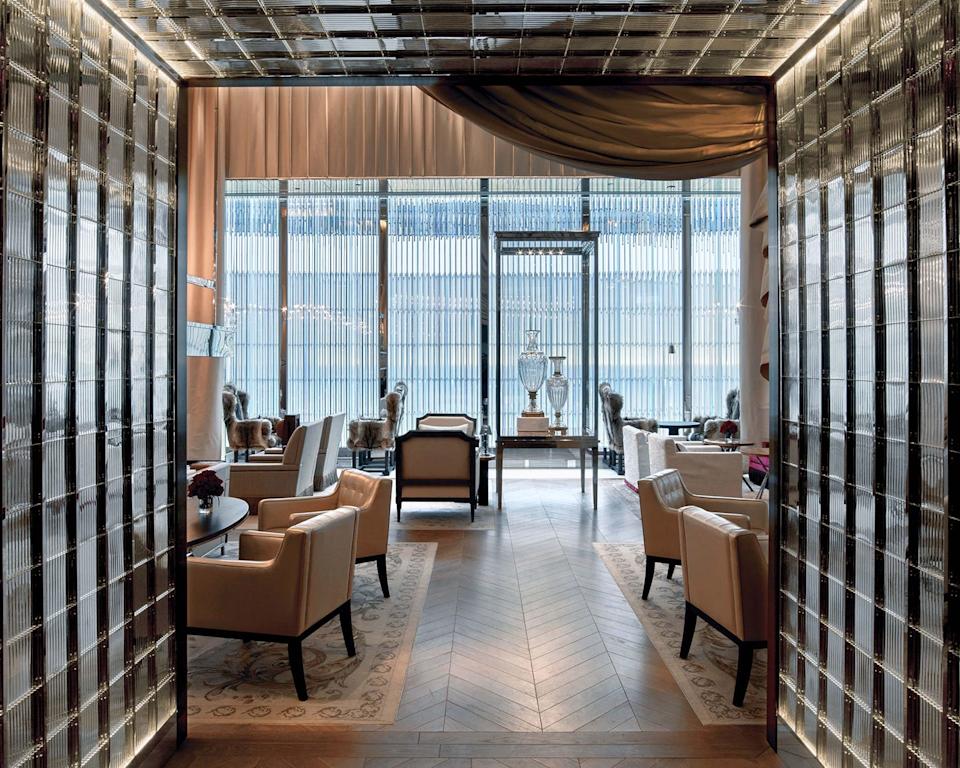 lounge area with modern seating and large windows