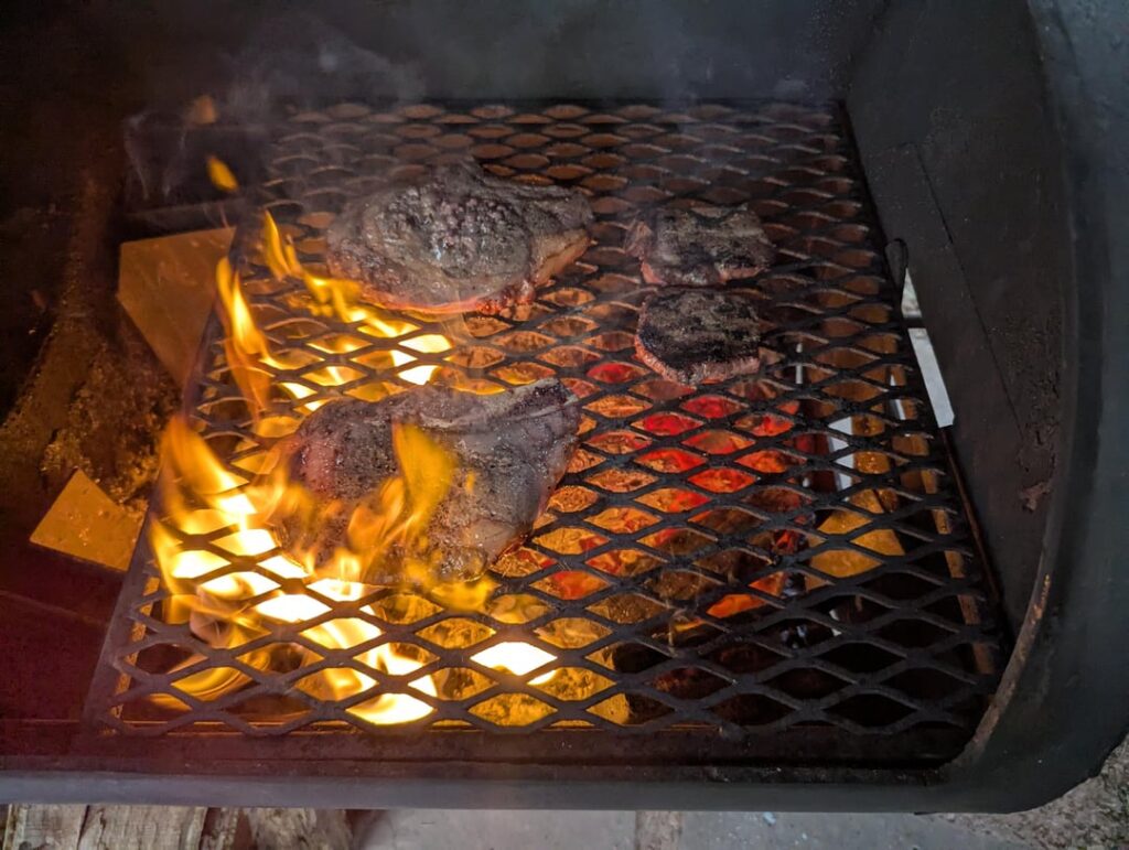 Locally sourced cow: filet and ribeye on mesquite coals.
