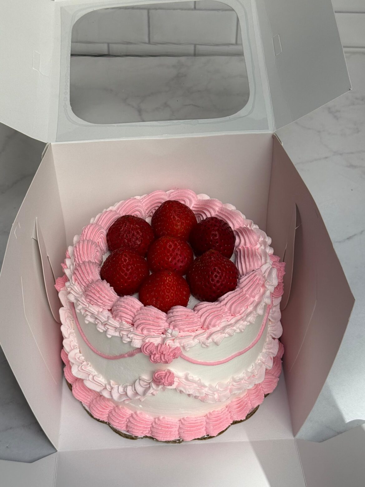 A strawberry cake covered Made by me♀️