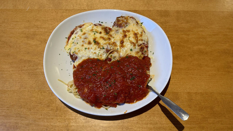 Olive Garden chicken parmigiana on white plate