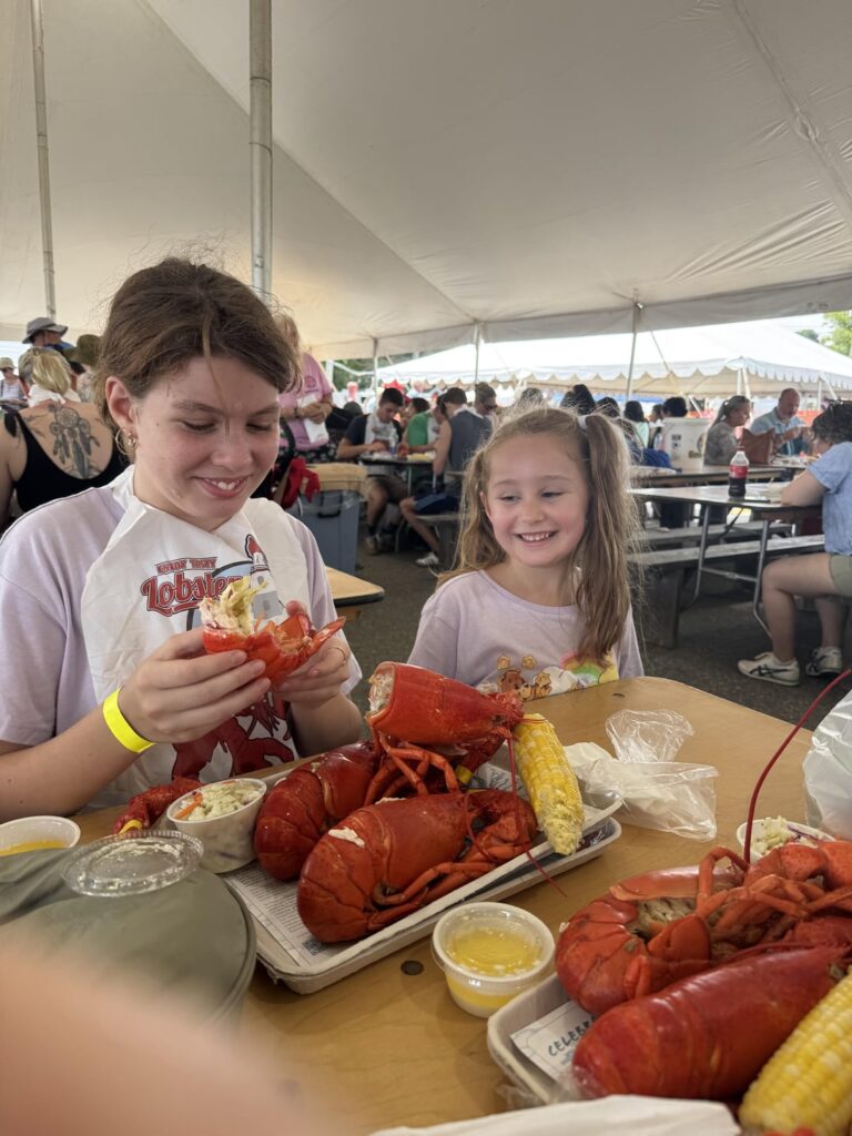 [I ate] Juicy whole lobster with warm butter, sweet corn, and creamy slaw at the Maine Lobster Festival