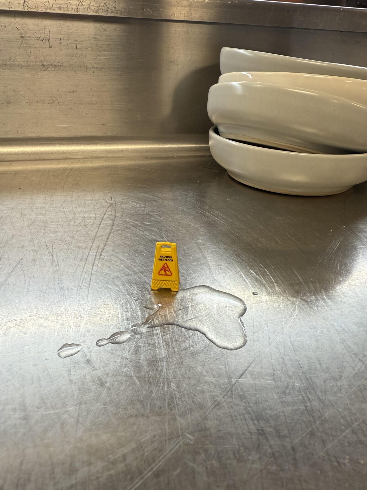 Please watch your step. We had a spill in the kitchen tonight.