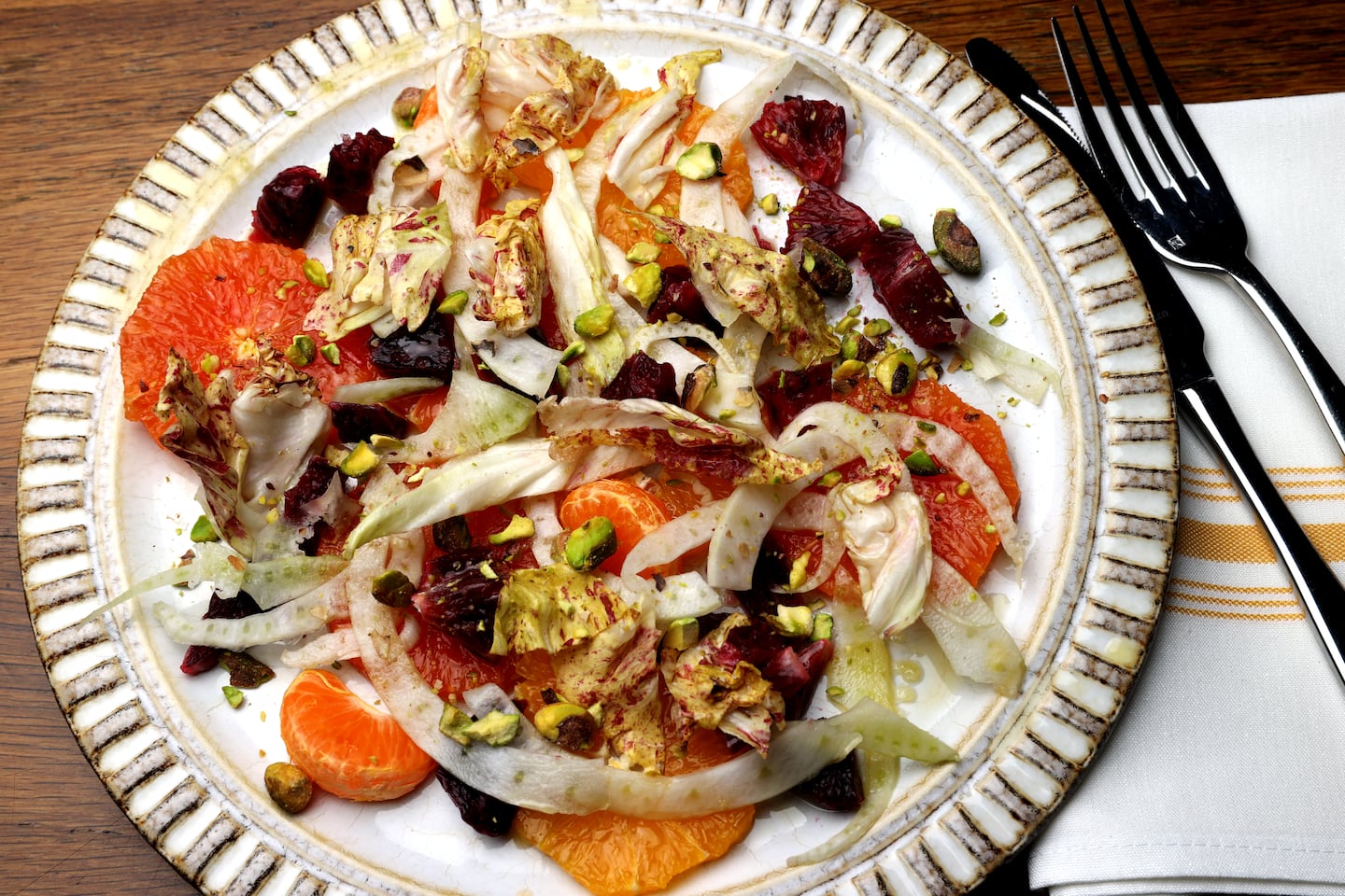 A salad of citrus, shaved fennel, Castelfranco lettuce, and pistachios.