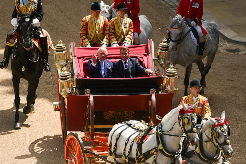 King Charles III and President of France, Emmanuel Macron arrive in a carriage at the Ceremonial Welcome for the state visit