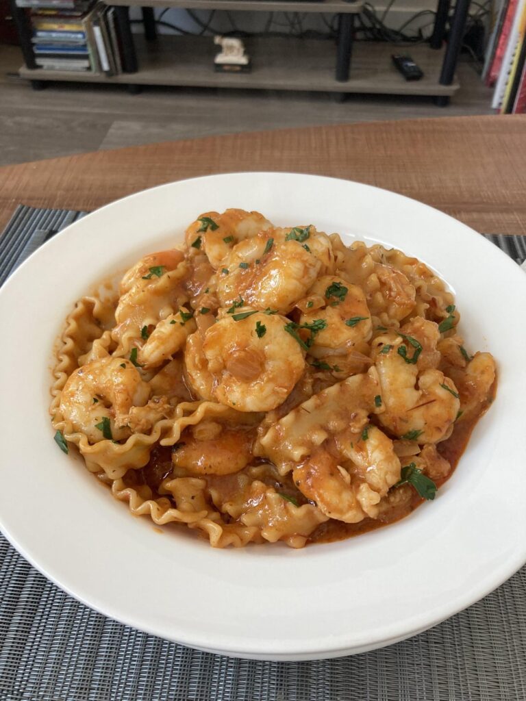 Mafaldine with shrimp and creamy spicy tomato sauce