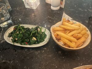Garlic baby spinach and truffle and cheese potato fries.