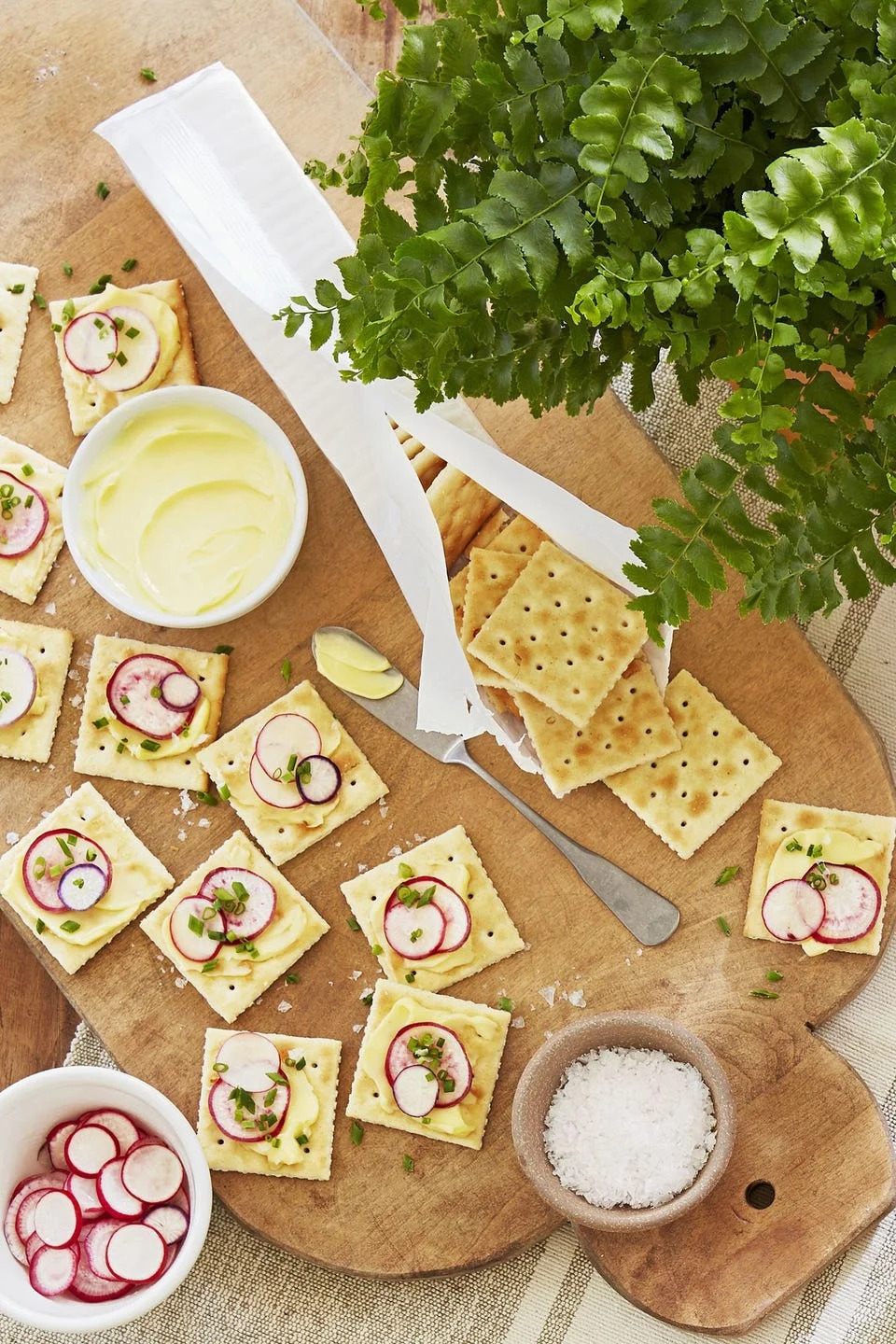 saltines with butter and radishes