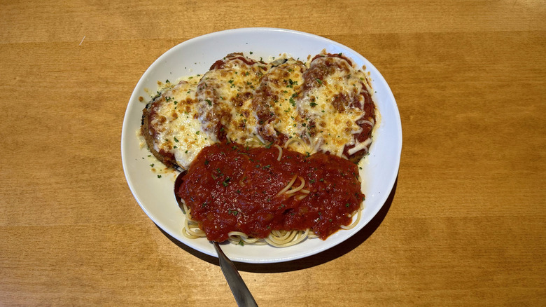 Olive Garden eggplant parmigiana on white plate
